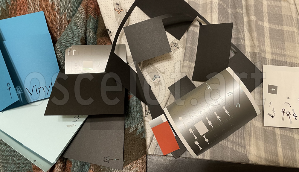 A pile of all the prototypes and cut bits of paper.